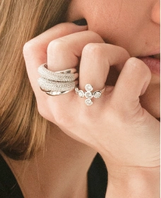 Hand wearing stacked diamond rings